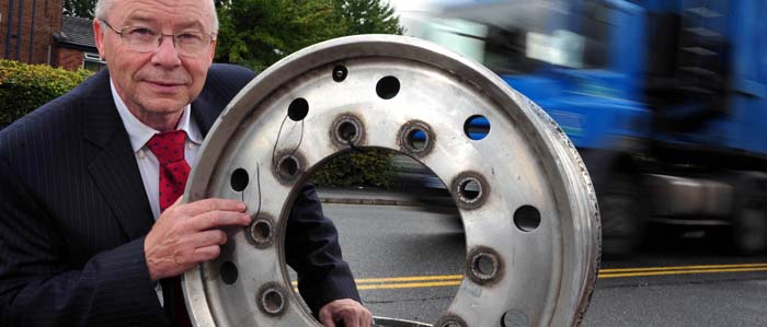 John Ellis, Managing Director of Motor Wheel Service, with a damaged CV wheel