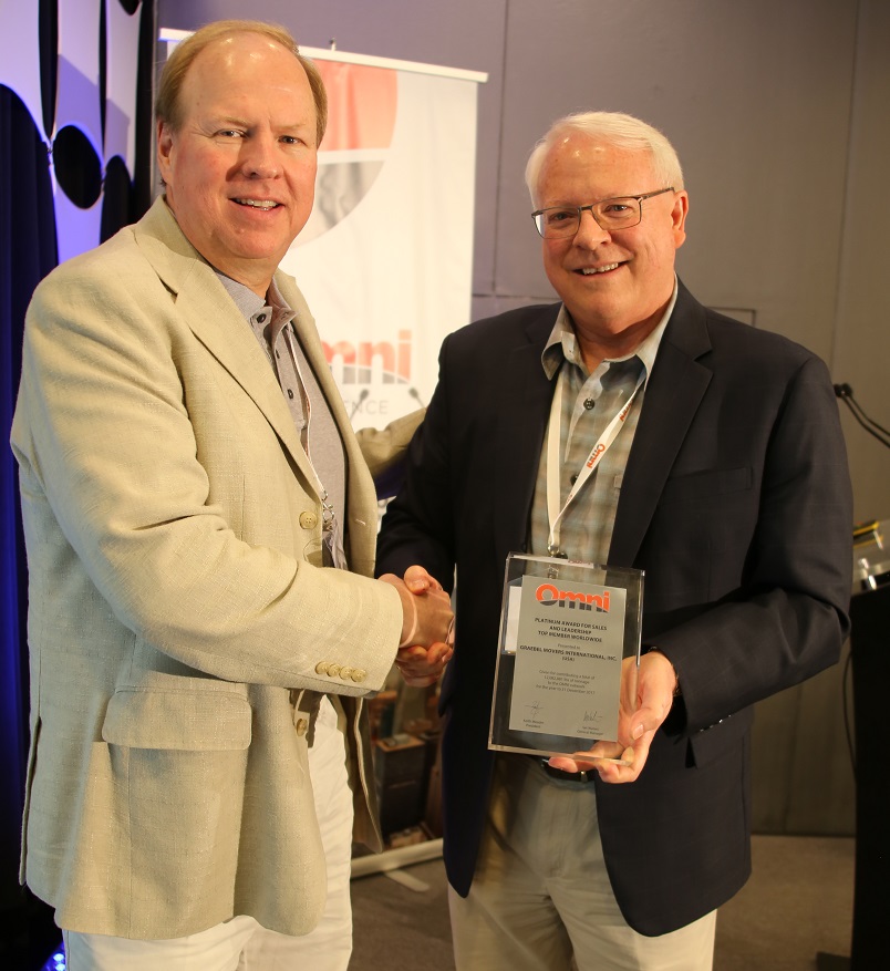 Dale Collins accepts the Platinum tonnage award from OMNI President, Keith Meader.