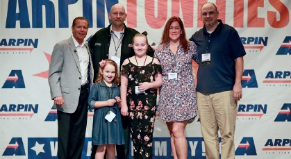 Driver of the Year Bob Cordeiro and family flanked by David Arpin (L) and Anthony Uriati, Vice President, Operations Department, Arpin Van Lines.