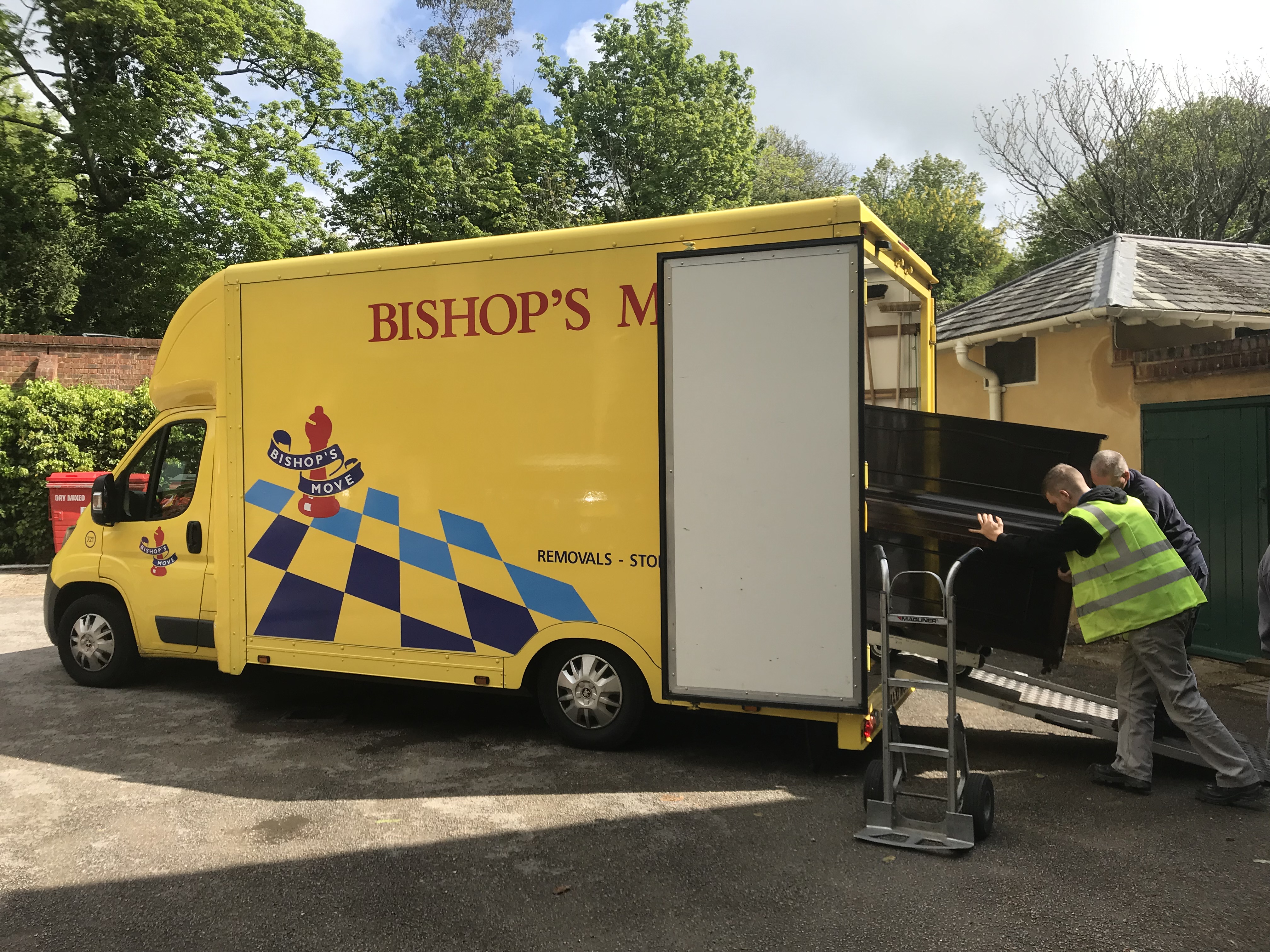 Bishop's Move porters load one of the donated pianos