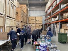 Volunteers pack food hampers at Alexanders&#39; new Heathrow warehouse