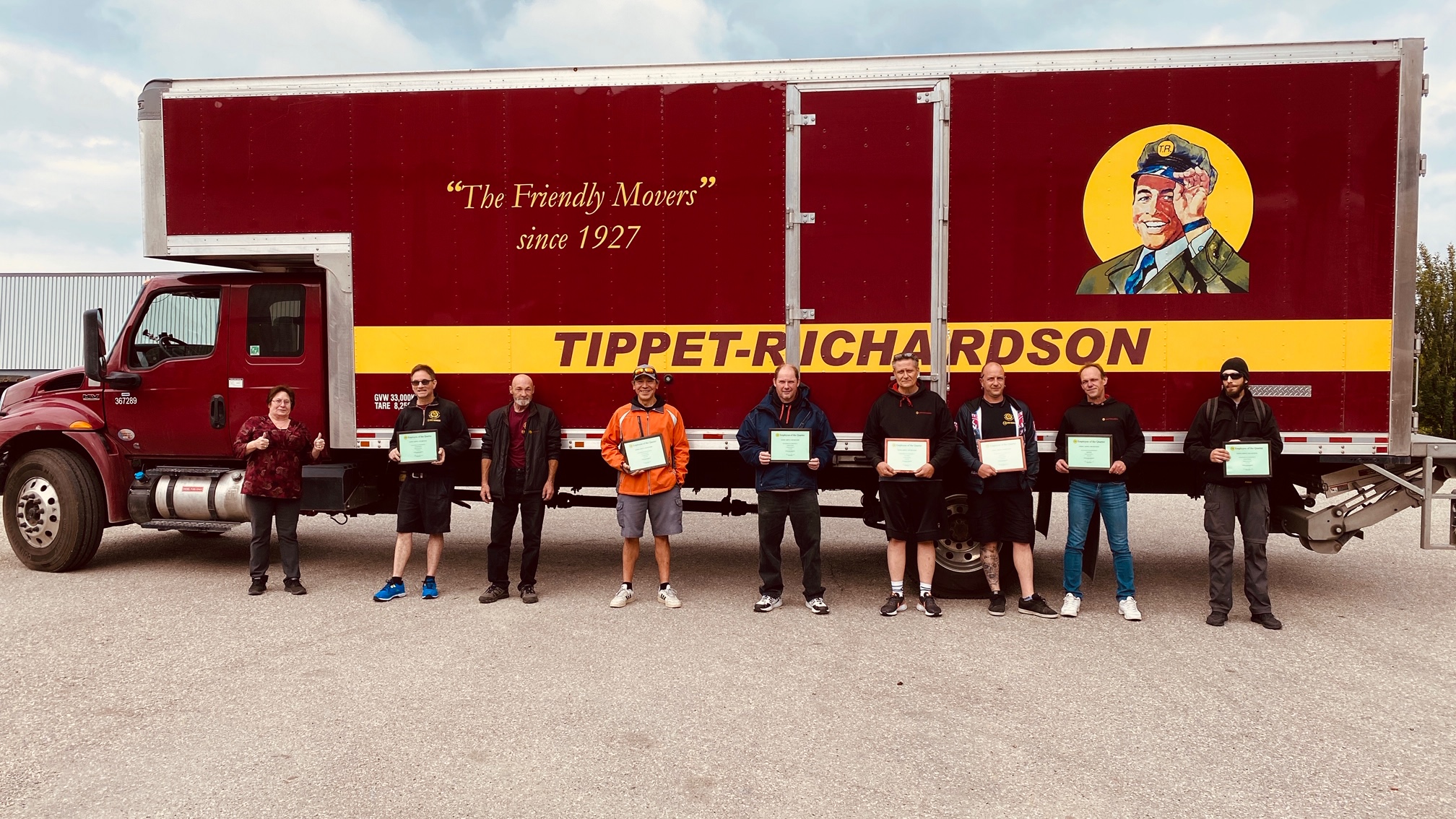 Calgary General Manager Brenda Bressler (L) with members of the crew.