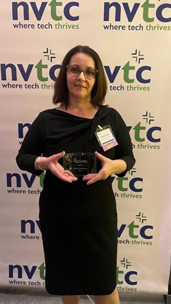 Diana Corona receiving a Tech 100 Company award.