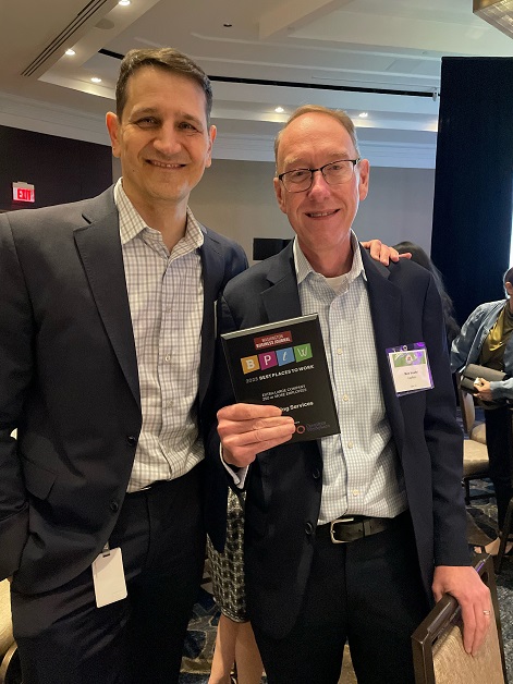 JK Moving President David Cox and Mark Woelfel of CapRelo