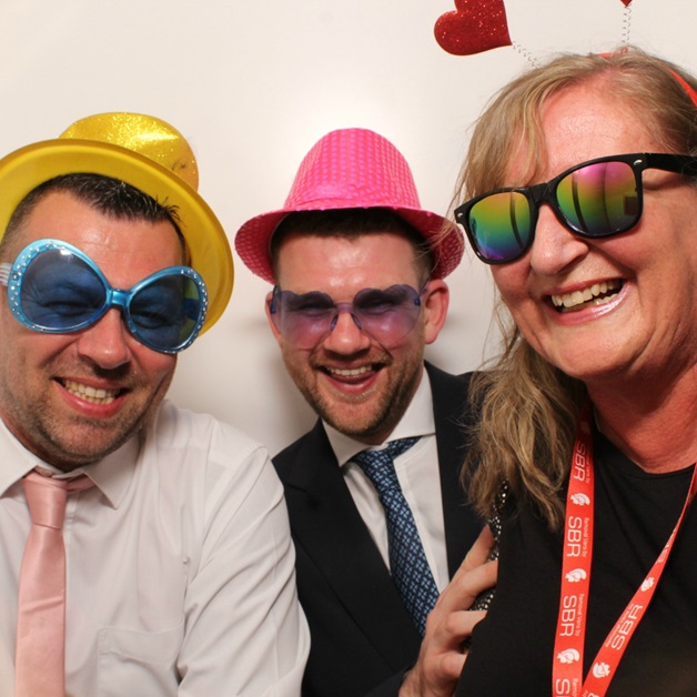 Michael Hart from Britannia Bearsbys, Tommy King from IFX Payments, and Tina Tyson from Britannia Beckwith enjoy the photobooth