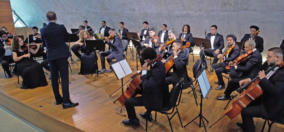 The ASM Orchestra playing to thank FINK for its donation