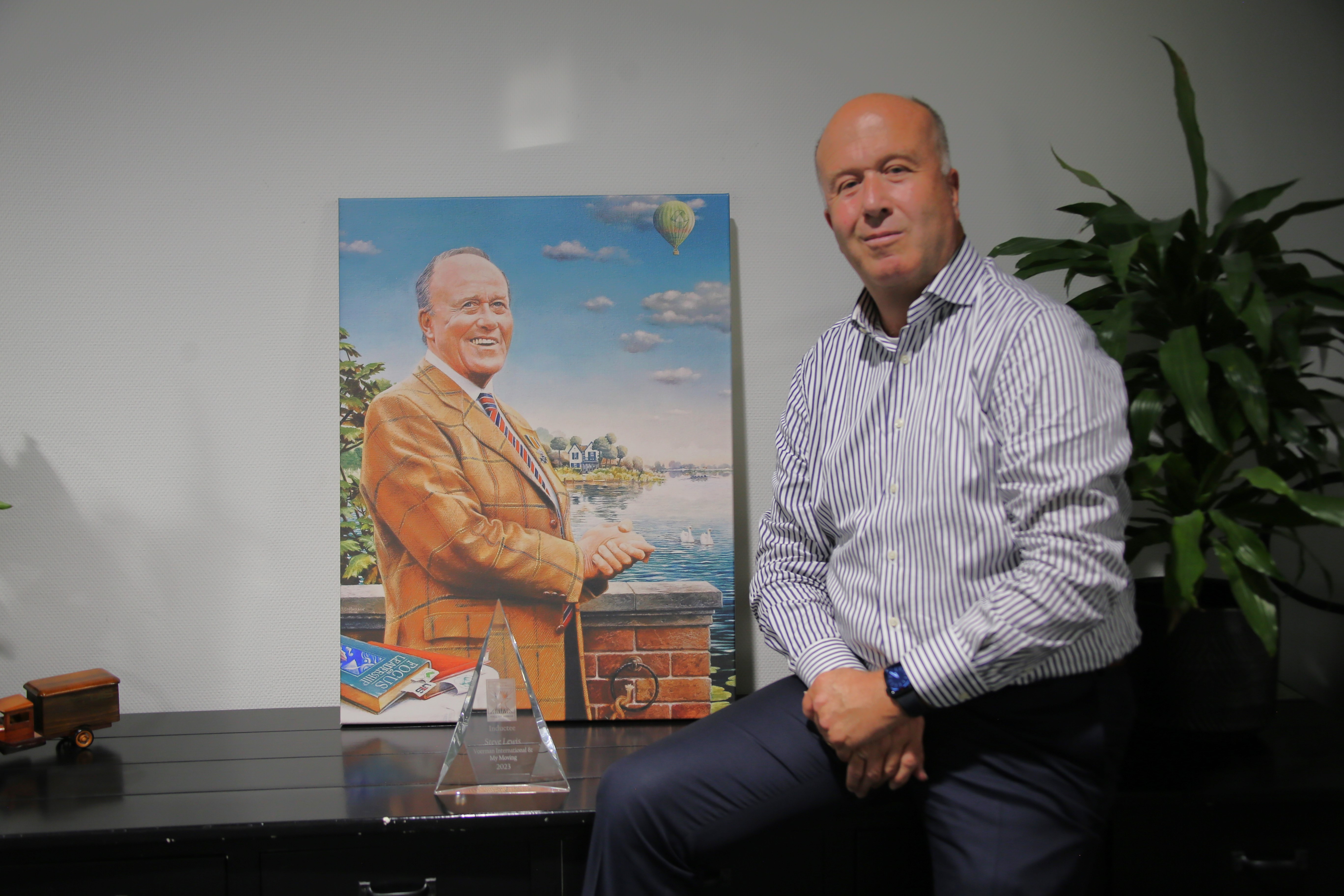 Robert Voerman with a portrait of his father