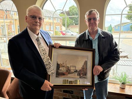 Trevor Kidd makes the presentation to Derek Canfield Trevor Kidd makes the presentation to Derek Canfield