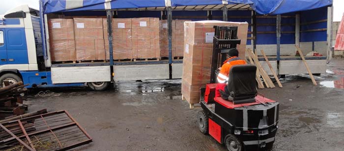 Afghanistan-bound pallets beign loaded